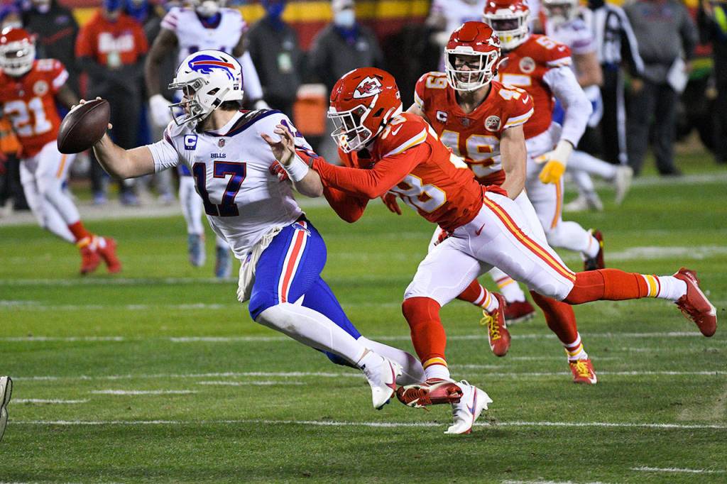 Buffalo Bills quarterback Josh Allen is sacked by Kansas City Chiefs safety LJarius Sneed (38) during the first half of the NFL AFC championship football game Sunday in Kansas City, Missouri. (AP Photo/Reed Hoffmann)