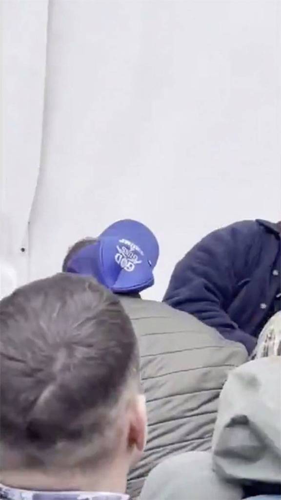 In this frame from video, Daniel Scotts God, Guns & Trump hat is visible as he tries to storm the U.S. Capitol building on Jan. 6 in Washington, D.C.