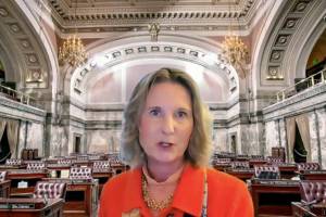 In this still image taken from video by TVW, Washington state's public affairs network, Washington Sen. Patty Kuderer, D-Bellevue, is shown against a virtual background as she speaks, Tuesday, Jan. 26, 2021, during a remote public hearing of the Senate Law & Justice Committee in Olympia, Wash. Kuderer is the sponsor of a measure that would ban the open carry of guns and other weapons on the Washington state Capitol campus and at or near any public demonstration across Washington state. (TVW via AP)