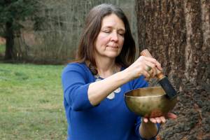Gail Kronberg plays a Tibetan singing bowl. The practice of sound therapy can have healing and soothing effects for listeners. Kronberg is one of many holistic healers who call Whidbey home. Photo by Kira Erickson/Whidbey News Group
