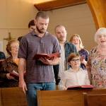 This image released by Apple shows, front row from left, Justin Timberlake, Ryder Allen and June Squibb in a scene from “Palmer.” (Apple via AP)