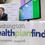 Brad Finnegan demonstrates the Washington Healthplanfinder website, where consumers will be able to shop for health insurance, following a news conference Monday, Sept. 30, 2013, in Seattle. The new site, which allows consumers to compare and purchase health insurance plans and to see if they are eligible for government subsidies, is Washington state's online answer to the Affordable Care Act, which is available to the public beginning Tuesday. (AP Photo/Elaine Thompson)