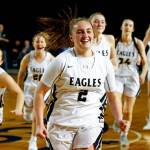 Hailey Hiatt celebrates with her Arlington teammates after hitting a game-winning shot in a victory over Shorecrest on March 5 at the Tacoma Dome. Arlington won 50-49 to advance to the Class 3A Hardwood Classic semifinals. (Kevin Clark / The Herald)