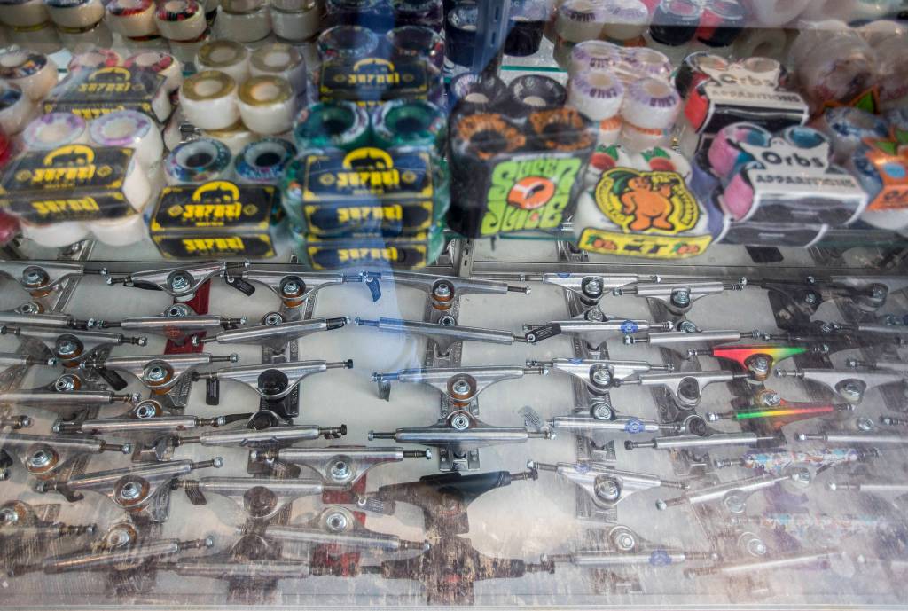 Suspensions and wheels on display at Pops Skate Shop in Everett. (Olivia Vanni / The Herald) 
