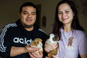 Javier Del Valle and Haley Del Valle with their guinea pigs Luna and Molly on Tuesday, Jan. 12, 2020 in Everett, Wa. (Olivia Vanni / The Herald)