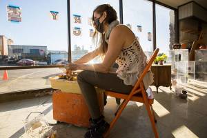 Rachel Recker works on a bowl at one of her pottery wheel stations at her new pottery studio, Salish Sea Ceramics, on Friday, Jan. 22, 2021 in Everett, Wa. (Olivia Vanni / The Herald)