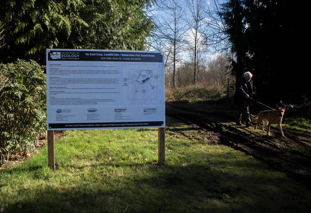 A sign with development information marks a trail into the Go East Corp. landfill site. (Olivia Vanni / The Herald)