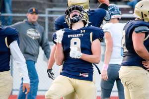 Sophomore Cavan Campbell celebrates after making a defensive stop against Meadowdale on Friday, Oct. 11 at Everett Memorial Stadium. (Katie Webber / The Herald)