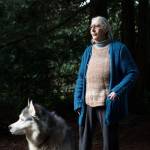 Marianne Edain, with her dog Takilna, is a longtime activist and, with husband Steve Erickson, founded the Whidbey Environmental Action Network (WEAN). (Andy Bronson / The Herald)