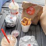 Caption: Eating fast food in the back of the car provides a brief release for pandemic-induced depression. (Jennifer Bardsley)