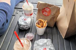 Caption: Eating fast food in the back of the car provides a brief release for pandemic-induced depression. (Jennifer Bardsley)