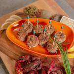 Serve Mardi Gras crawfish cakes with lemon wedges and a garlic-caper remoulade. (Tulalip Resort Casino)