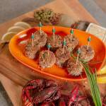 Serve Mardi Gras crawfish cakes with lemon wedges and a garlic-caper remoulade. (Tulalip Resort Casino)