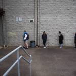 Students line up, social distanced, before entering Sultan High School on Thursday. (Olivia Vanni / The Herald)