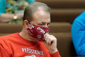 Initiative promoter Tim Eyman listens during a session of Thurston County Superior Court, Wednesday, Feb. 10, 2021, in Olympia, Wash. Eyman, who ran initiative campaigns across Washington for decades, will no longer be allowed to have any financial control over political committees, under a ruling from Superior Court Judge James Dixon Wednesday that blasted Eyman for using donor's contributions to line his own pocket. Eyman was also told to pay more than $2.5 million in penalties. (AP Photo/Ted S. Warren)
