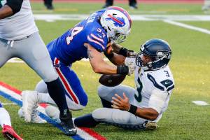 Buffalo Bills' A.J. Klein (54) strip sacks Seattle Seahawks quarterback Russell Wilson (3) during the second half of an NFL football game Sunday, Nov. 8, 2020, in Orchard Park, N.Y. (AP Photo/Jeffrey T. Barnes)