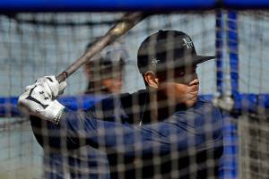 Seattle Mariners' Julio Rodriguez bats during spring training baseball practice Thursday, Feb. 13, 2020, in Peoria, Ariz. (AP Photo/Charlie Riedel)