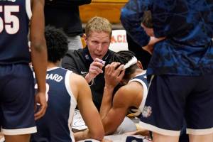 FILE - In this Feb. 4, 2021, file photo, Gonzaga coach Mark Few huddles with his team during a timeout in the second half of an NCAA college basketball game against Pacific in Stockton, Calif. Few isn't being asked questions about where his team should be seeded for next month's NCAA Men's Basketball Tournament. Instead, the longtime coach is getting a different question with a little more than a month until Selection Sunday — does it make any sense for Gonzaga to compete in its conference tournament? (AP Photo/Rich Pedroncelli, File)