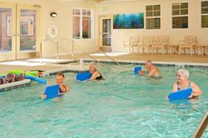 Quail Park of Lynwood residents enjoy a swimming pool, gym outfitted with senior-oriented HUR equipment, a full-time professional instructor and more to support heart-heathly active living.