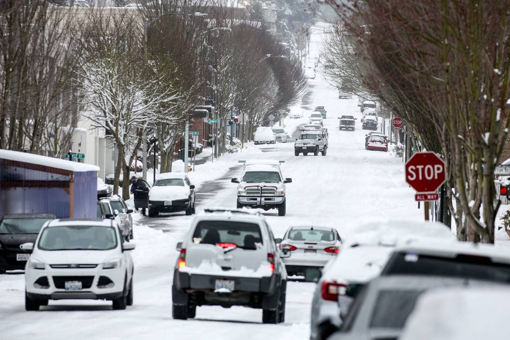 Snowy roads Saturday in Edmonds. (Kevin Clark / The Herald)