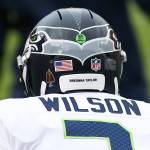 Seattle Seahawks quarterback Russell Wilson (3) dons a helmet sticker as a Walter Payton Man of The Year nominee and says "Breonna Taylor" before an NFL football game against the Washington Football Team, Sunday, Dec. 20, 2020 in Landover, Md. (AP Photo/Daniel Kucin Jr.)