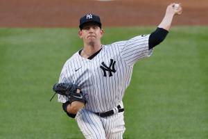 FILE - In this Aug. 2, 2020, file photo, New York Yankees starting pitcher James Paxton throws during the first inning of a baseball game against the Boston Red Sox in New York. Paxton is returning to the Seattle Mariners after an injury-filled second season with the Yankees. The 32-year-old left-hander and the Mariners agreed Saturday, Feb. 13, to an $8.5 million, one-year contract, a person with knowledge of the negotiations told The Associated Press. The person spoke on condition of anonymity because the agreement was subject to a successful physical.( AP Photo/Kathy Willens, File)