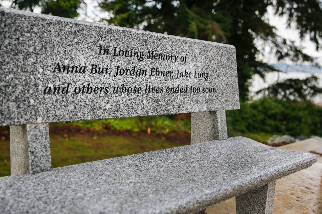 A bench that honors the three Kamiak High School graduates killed in a house party in 2o16 is a feature of the Byers Family Park, also known as Peace Park, in Mukilteo. (Kevin Clark/The Herald)