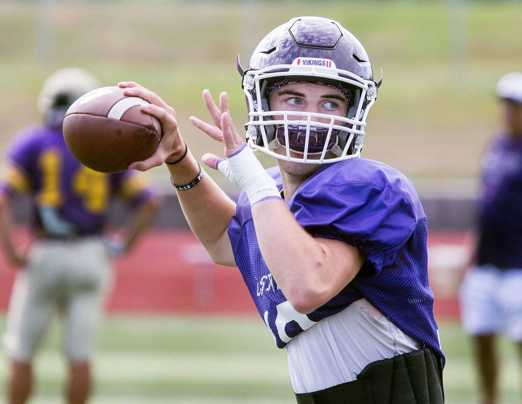 Lake Stevens quarterback Tanner Jellison looks for a receiver during practice Aug. 29, 2019 in Lake Stevens. (Andy Bronson / The Herald)