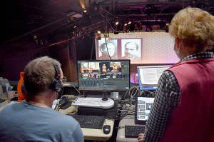 Sue and Jim Riney watch the actresses on stage during a filmed rehearsal at Whidbey Playhouse in Oak Harbor. (Emily Gilbert / Whidbey News-Times)