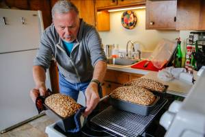Gerry Betz makes bread at his home Saturday morning in Everett on February 20, 2021. Betz is the Community Loaves coordinator of the Everett Hub. (Kevin Clark / The Herald)