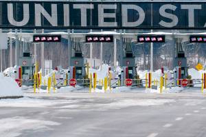 The border crossing into the United States is seen during the COVID-19 pandemic in Lacolle, Quebec, on Friday, Feb. 12, 2021. Tighter border controls will come into effect Feb. 22, the prime minister said Friday, not to punish travelers but to try to keep everyone safe. (Paul Chiasson/The Canadian Press via AP)