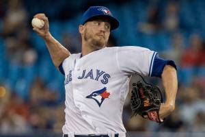 FILE - Toronto Blue Jays pitcher Ken Giles throws to a Boston Red Sox batter during the 10th inning of a baseball game in Toronto, in this Tuesday, Aug. 7, 2018, file photo. The Seattle Mariners finalized a $7 million, two-year contract with reliever Ken Giles on Friday, Feb. 19, 2021, that includes a club option for the 2023 season. Seattle signed Giles knowing he won’t pitch for the Mariners this season while recovering from Tommy John surgery. (Fred Thornhill/The Canadian Press via AP, File)
