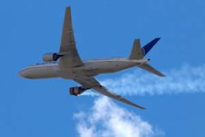 This Saturday, Feb. 20, 2021 photo provided by Hayden Smith shows United Airlines Flight 328 approaching Denver International Airport, after experiencing "a right-engine failure" shortly after takeoff from Denver. Federal regulators are investigating what caused a catastrophic engine failure on the plane that rained debris on Denver suburbs as the aircraft made an emergency landing. Authorities said nobody aboard or on the ground was hurt despite large pieces of the engine casing that narrowly missed homes below. (Hayden Smith via AP)