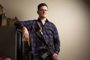When not at home, Brett Bass keeps his rifle locked in a 600-lb. safe at his home on Tuesday, Oct. 23, 2018 in Edmonds, Wa. Bass, an NRA certified firearms instructor and safety officer, is one of three Edmonds residents who sued to block the city's safe storage gun law from being enforced. (Andy Bronson / The Herald)