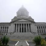 FILE - In this Jan. 7, 2021, file photo, the Legislative Building is shown partially shrouded in fog at the Capitol in Olympia, Wash. Washington state's richest residents, including Bill Gates and Jeff Bezos, would pay a wealth tax on certain financial assets worth more than $1 billion under a proposed bill whose sponsor says she is seeking a fair and equitable tax code. Under the bill, starting Jan. 1, 2022, for taxes due in 2023, a 1% tax would be levied not on income, but on "extraordinary" assets ranging from cash, publicly traded options, futures contracts, and stocks and bonds. (AP Photo/Ted S. Warren, File)