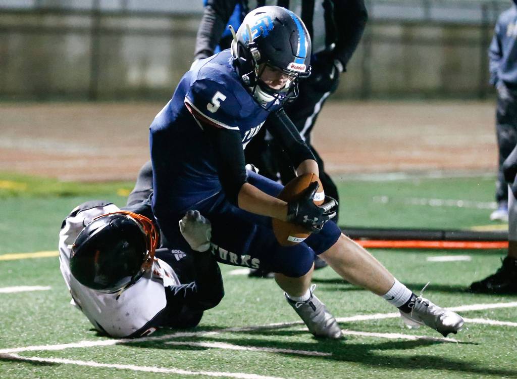 Sultans Westin Bauer is tackled shy of the goal line by Granite Falls Jace Stevens. (Kevin Clark / The Herald)