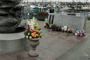 The Seattle Fishermen's Memorial is shown Thursday, Jan. 2, 2020 in Seattle. Items left at the memorial Thursday included a ball cap with the name of the crab fishing boat Scandies Rose. The search for five crew members of the Scandies Rose in Alaska has been suspended, the U.S. Coast Guard said after two other crew members of the vessel were rescued after the 130-foot crab fishing boat from Dutch Harbor, Alaska, sank on New Year's Eve. (AP Photo/Ted S. Warren)