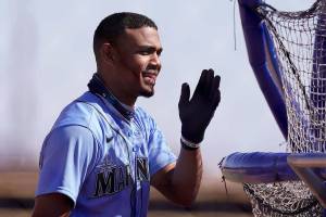 Seattle Mariners' Julio Rodriguez waits to bat during spring training baseball practice Thursday, Feb. 25, 2021, in Peoria, Ariz. (AP Photo/Charlie Riedel)
