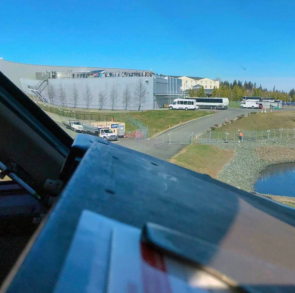 A pilots eye view from the cockpit of a Boeing 747: Visitors atop the observation deck at the Boeing Future of Flight at Paine Field in Everett. (Kelsey Hughes)