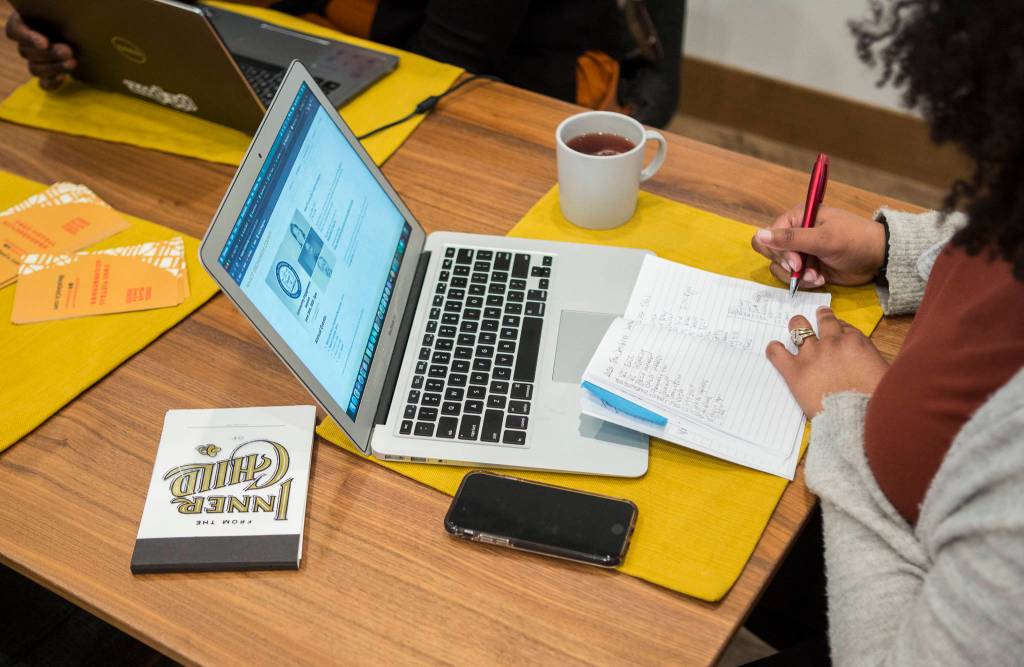 Avianca Walker-Loundermon adds items to a to-do list on Feb. 23 in Everett. (Olivia Vanni / The Herald)