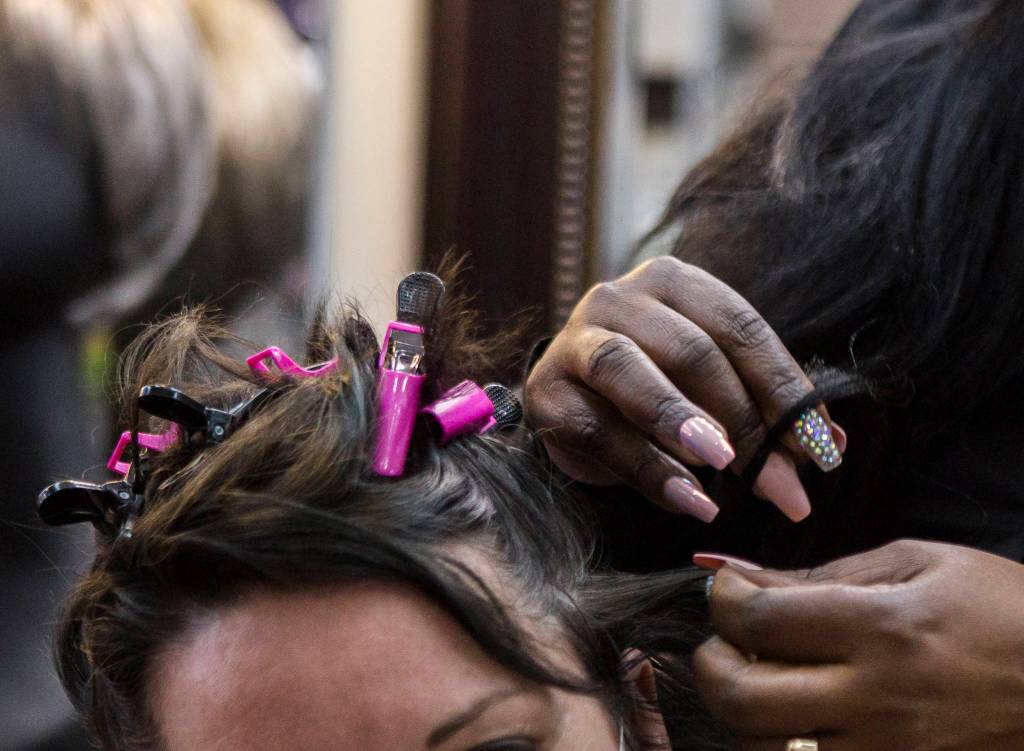 Decarla Stinn at work in her shop in Everett. (Olivia Vanni / The Herald)