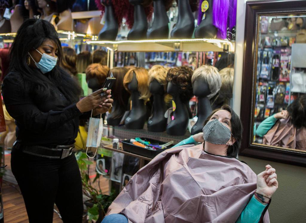 Hope Hottemdorf poses for a before picture before getting extensions at Decarlas Beauty Supply Salon in Everett. (Olivia Vanni / The Herald)