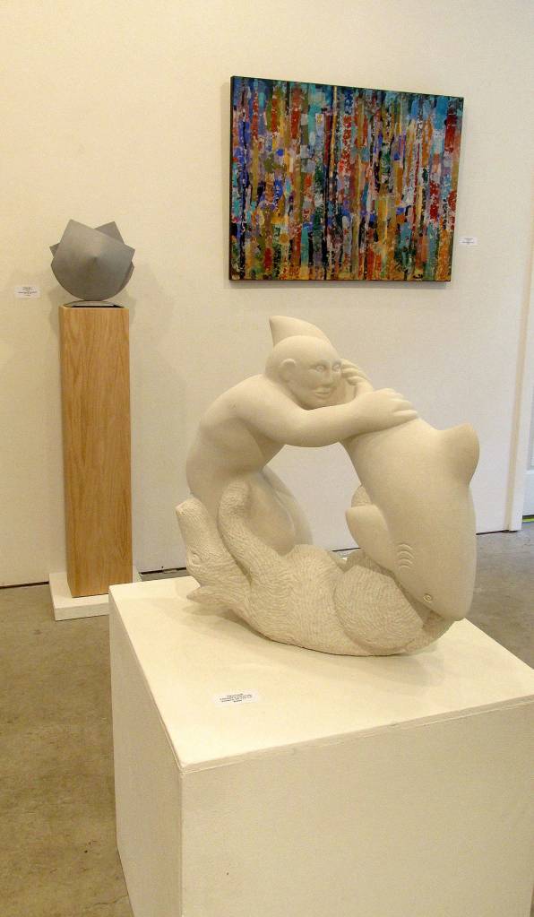 Tracy Powells 3 Brothers limestone carving of a man, wolf and a shark is part of his Circle of Life series.