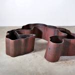 Aaron Loveitt's salvaged-steel sculpture titled "Fell" is a replica of an old-growth Western red cedar.