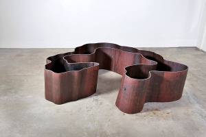 Aaron Loveitt's salvaged-steel sculpture titled "Fell" is a replica of an old-growth Western red cedar.