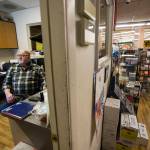 Randy Ashe works in the front office of the IGA in Darrington. (Olivia Vanni / The Herald)