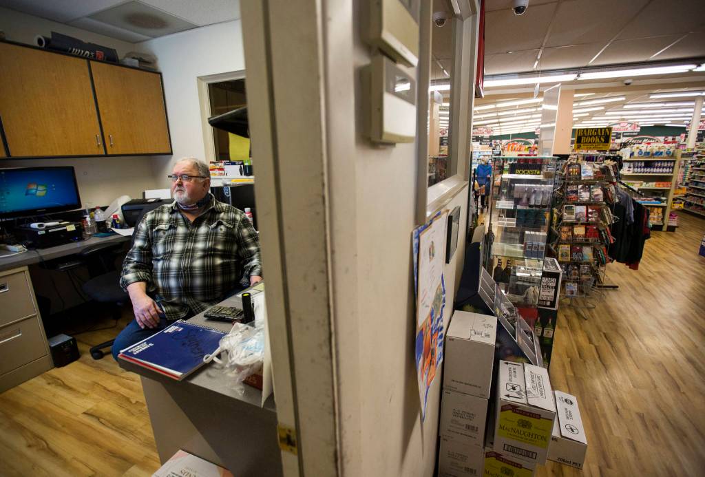 Randy Ashe works in the front office of the IGA in Darrington. (Olivia Vanni / The Herald)