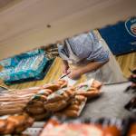 Kevin Ashe inventories meat at the IGA in Darrington, which his family has owned for decades. (Olivia Vanni / The Herald)
