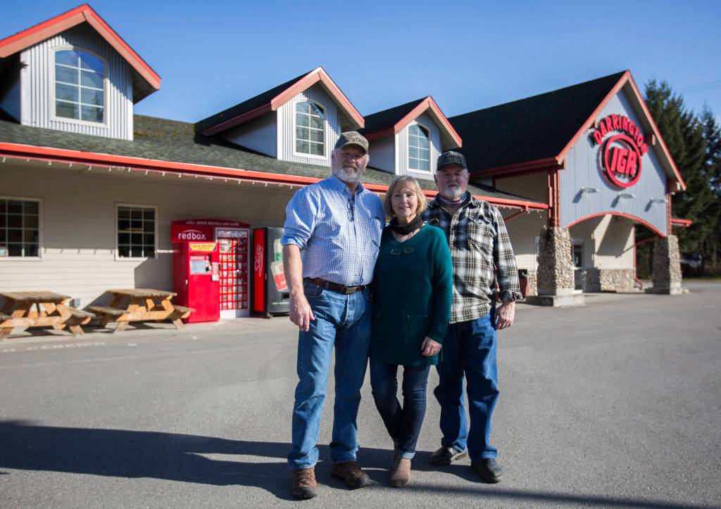 Kevin Ashe, Shelia Ashe and Randy Ashe outside of Darrington IGA. (Olivia Vanni / The Herald)