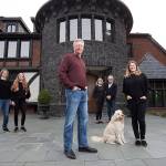 The Bayernmoor Cellars family, from left: Maddie Harris, 16, Sophie Harris, 13, Larry Harris, Kate Beisecker, Jim Beisecker and Kim Harris. With them is Lucy the Labradoodle. (Andy Bronson / The Herald)